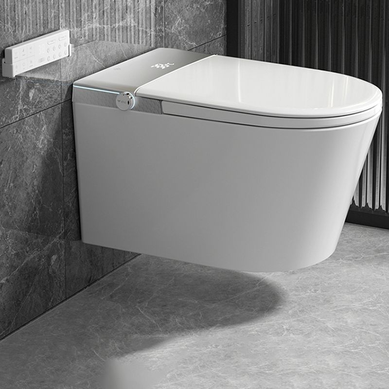 The Refurne Modern Japanese Wall-Mounted Smart Toilet features a heated seat, remote control, and advanced hygiene features; its sleek white design is installed against a gray marble wall.