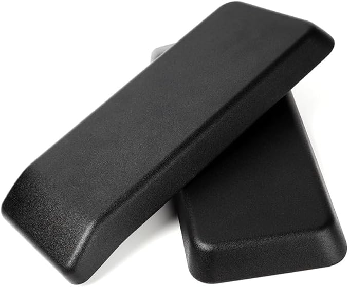 A pair of black Refurne Haworth Very Chair Replacement Arm Pads are stacked on a white background, providing ergonomic support for your chair.
