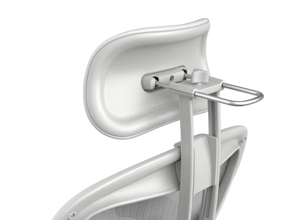 Close-up of the Refurne Herman Miller Aeron Headrest by Atlas – Cushion Edition (Mineral) in white and silver, showing its adjustable ergonomic design, curved shape, mounting hardware, and part of the mesh backrest.