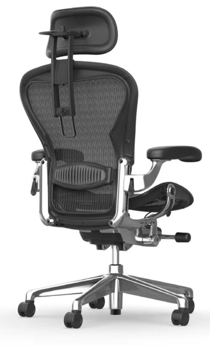 The Refurne Herman Miller Aeron Headrest by Atlas – Cushion Edition (Graphite) features a mesh back, adjustable cushion headrest, armrests, lumbar support, and a sturdy metal base with five caster wheels, shown from the back.