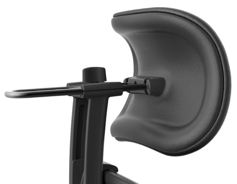 Close-up of the Refurne Herman Miller Aeron Headrest by Atlas – Cushion Edition (Graphite) on an ergonomic chair, showcasing its curved, padded ergonomic support and adjustable frame.