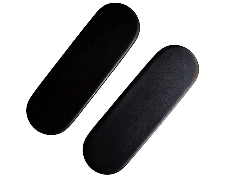Two black vinyl foam oval-shaped replacement armpads from Refurne, shown parallel on a white background, compatible with Herman Miller Sayl chairs.