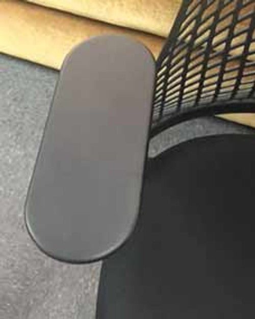 Close-up of the Refurne Herman Miller Sayl 2 office chair, showcasing its 4D adjustable black armpads and part of the seat against a carpeted floor—a stylish, sustainable workspace upgrade.