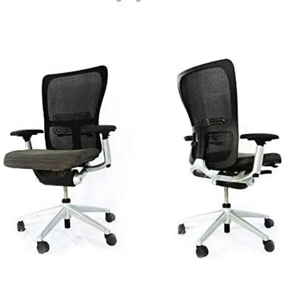Two black and gray ergonomic office chairs with mesh backs and adjustable armrests are shown from front and rear—perfect for pairing with Refurne’s Haworth Zody Chair Replacement Arm Pads – Black (Pair).