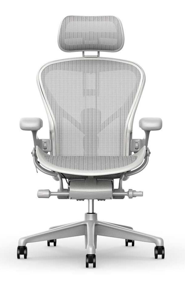 The Refurne Atlas Headrest in Mineral is designed for the Herman Miller Aeron Remastered Chair, shown here with an ergonomic mesh back, adjustable armrests, and a five-wheel base against a white background.